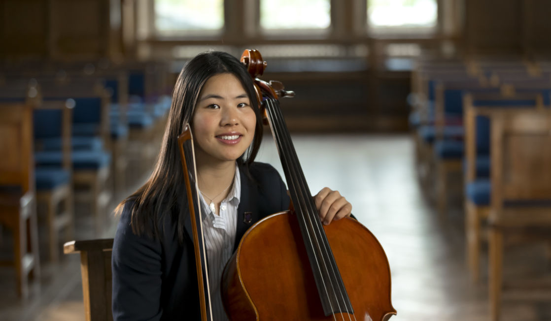 wycliffe girl holding a cello