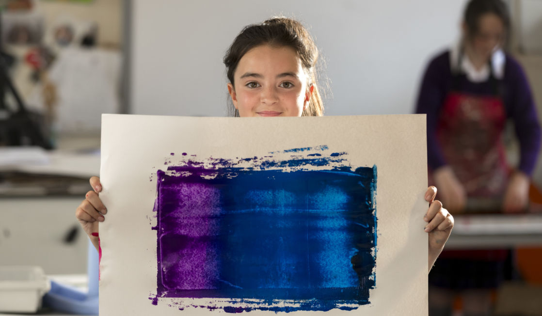 wycliffe pupil holding a painting