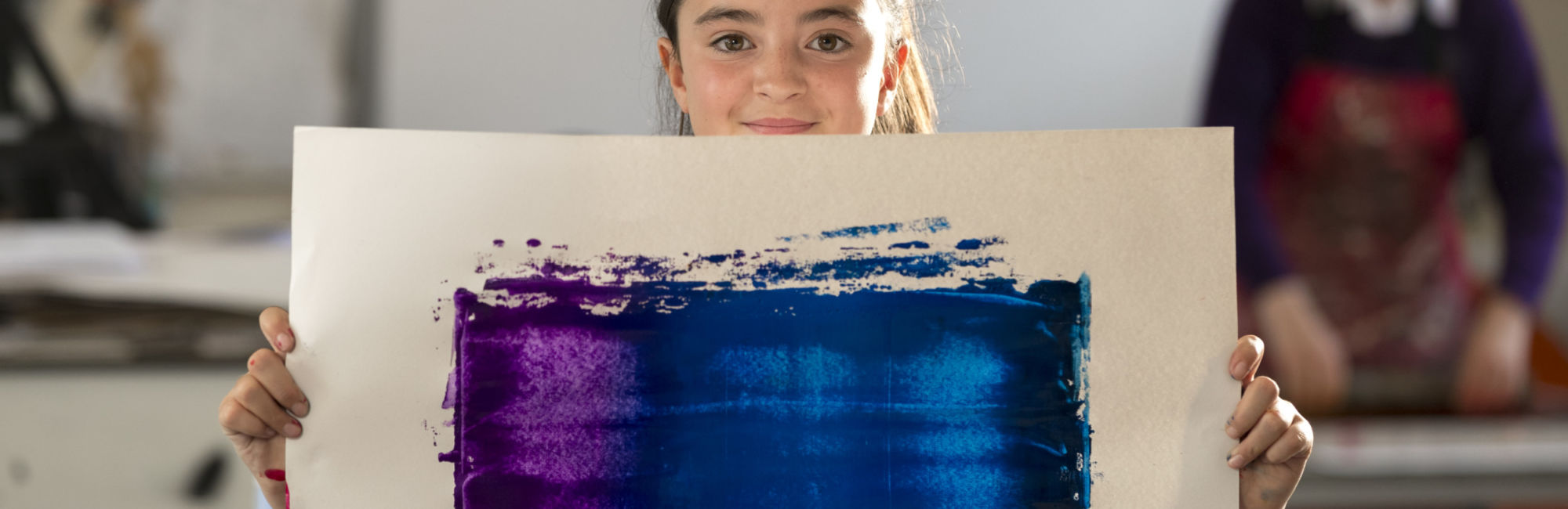 wycliffe pupil holding a painting