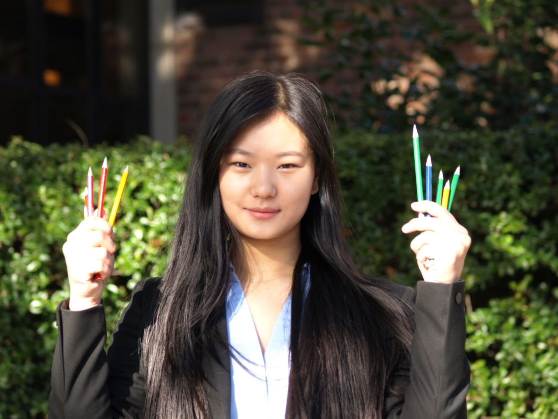 wycliffe pupil sophia holding colored pencils