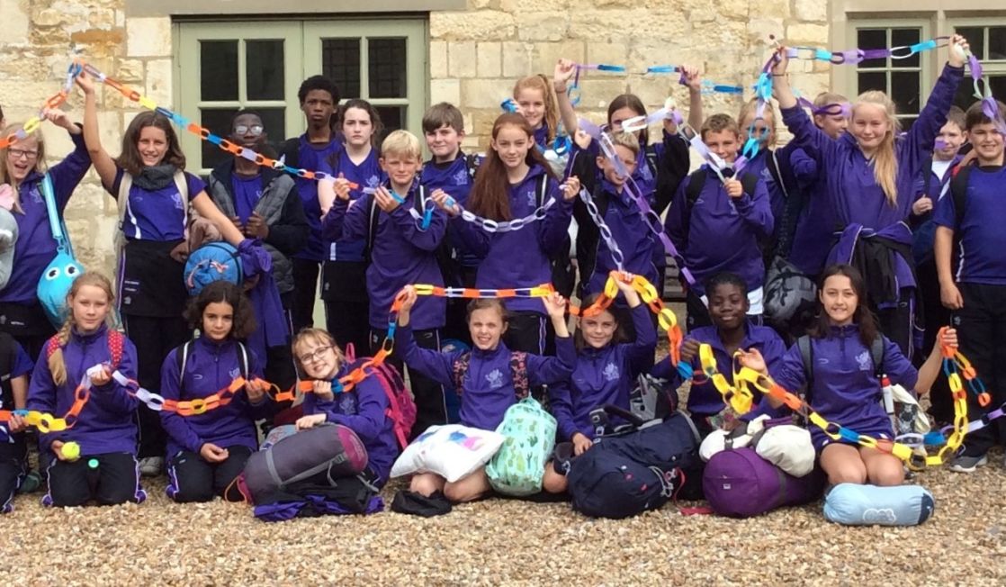 wycliffe pupils holding decorations outdoors