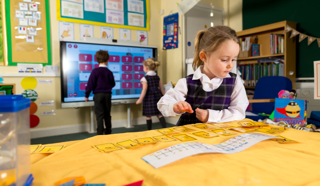 wycliffe nursery girl playing with cards in class