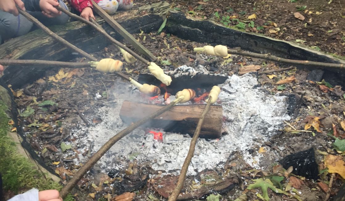 forest school kids outdoors eating smores