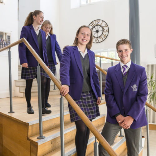 wycliffe students smiling in staircase