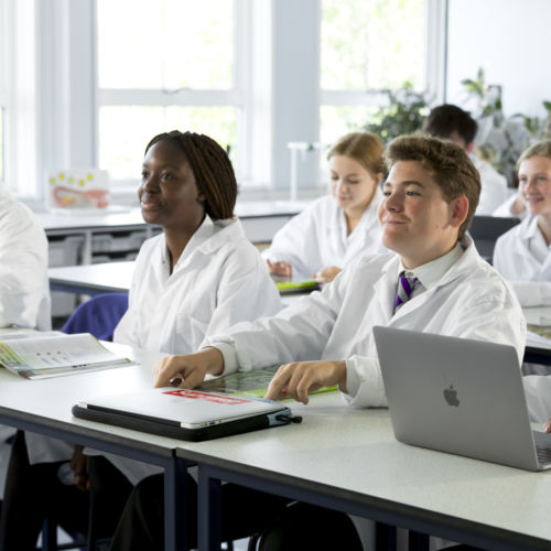 wycliffe pupils wearing lab coat in class