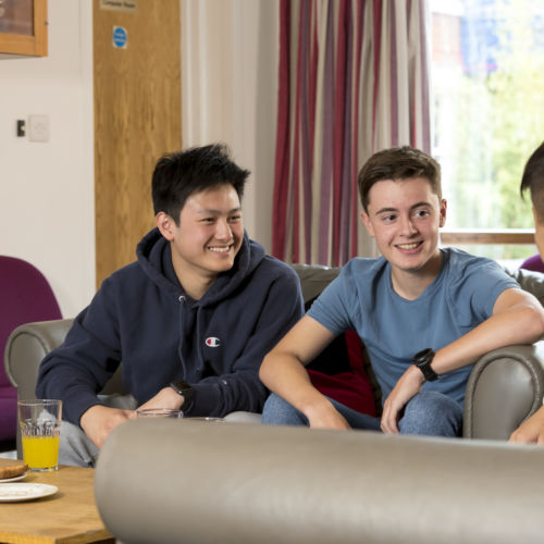 wycliffe boarding students sitting in the lounge room