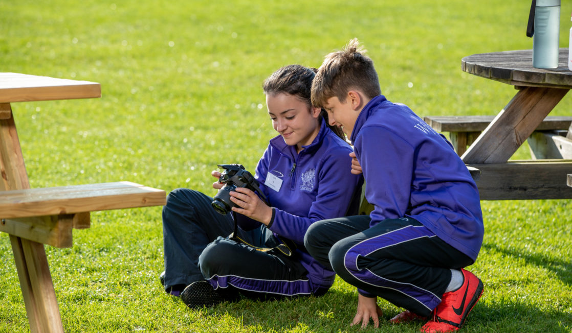 Wycliffe students using a camera