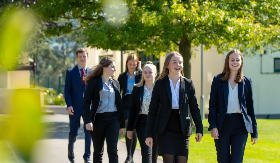 Wycliffe sixth form uniform pupils outside walking