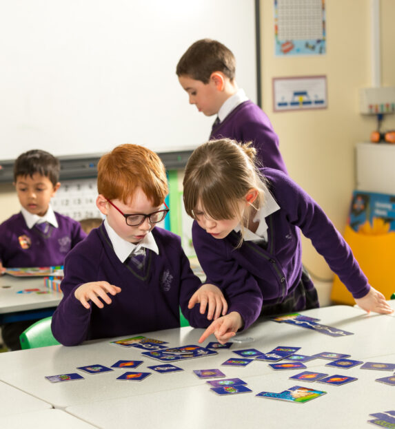 wycliffe pupils playing with cards in class