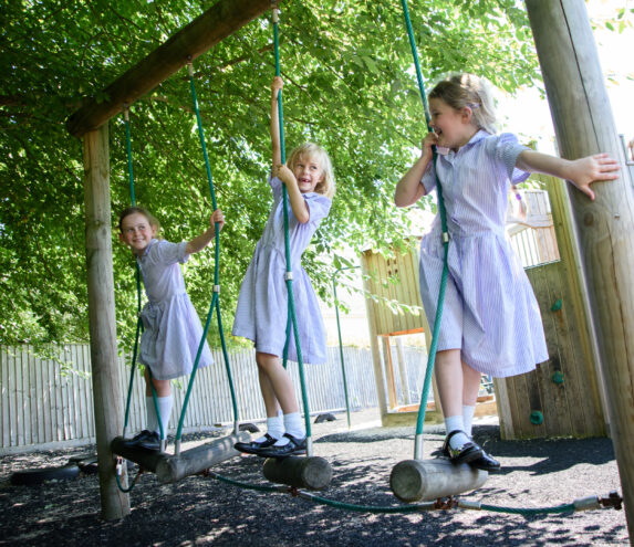 wycliffe girls playing on swings