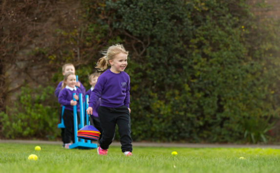 wycliffe nursery girl running in the playground