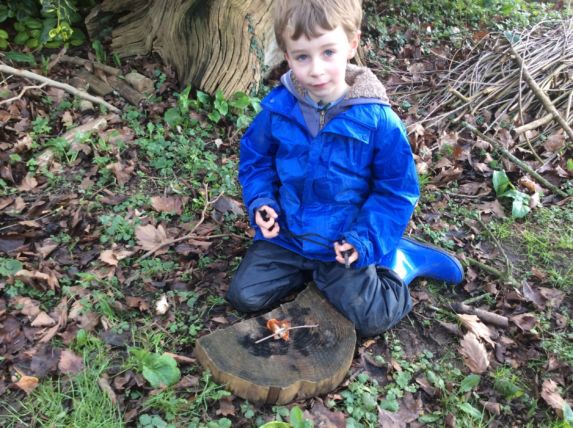 wycliffe pupil making fire in forest school