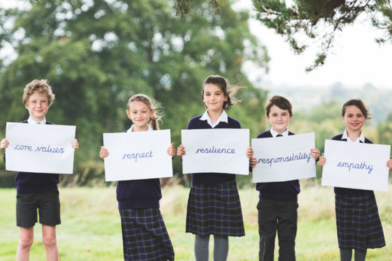wycliffe pupils holding signs with values written