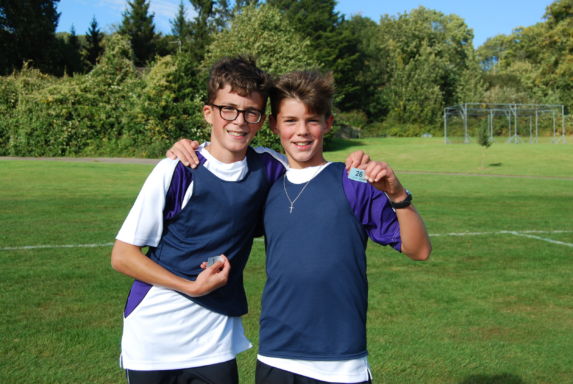 wycliffe boys smiling in a football field