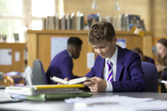 wycliffe pupil reading in the library