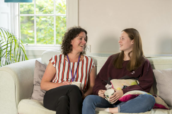 wycliffe pupil and teacher sitting on a couch