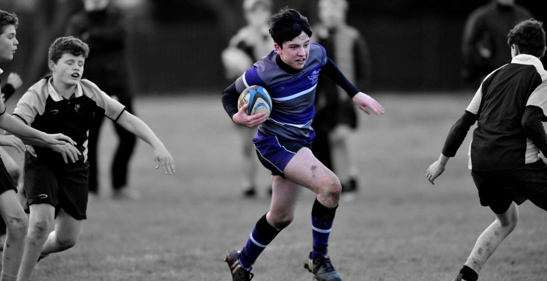 highlighted image of wycliffe boy playing rugby