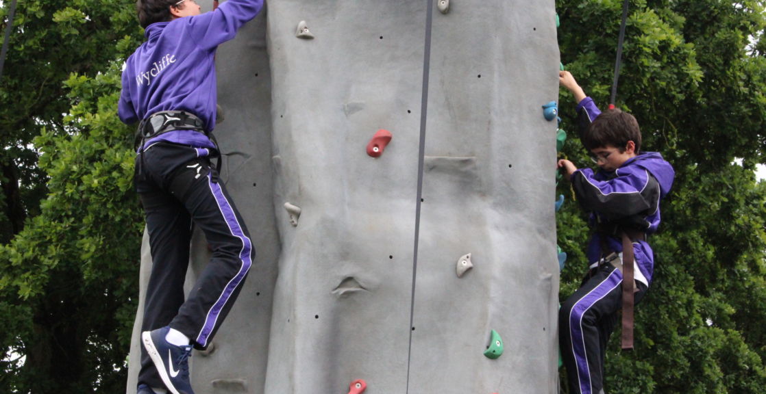 wycliffe pupils climbing a rock wall
