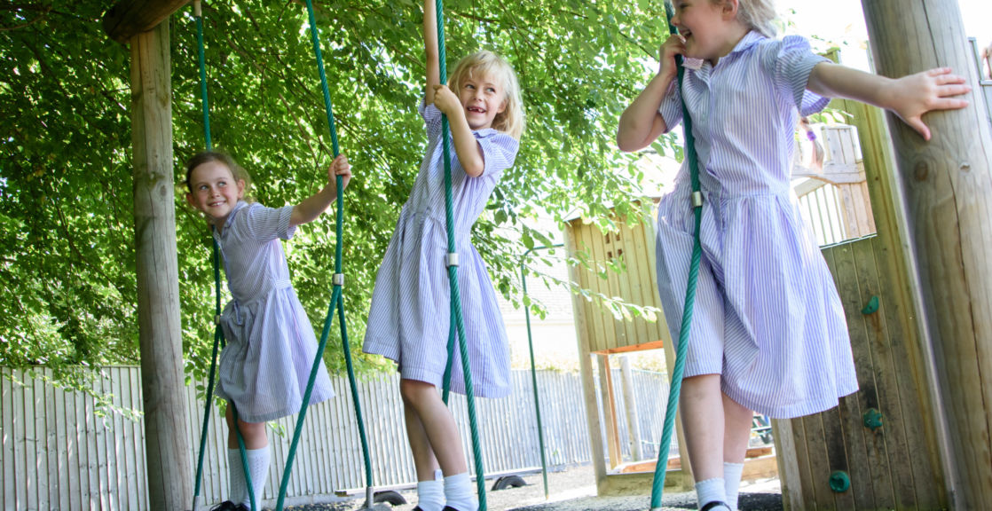 wycliffe girls playing on swings