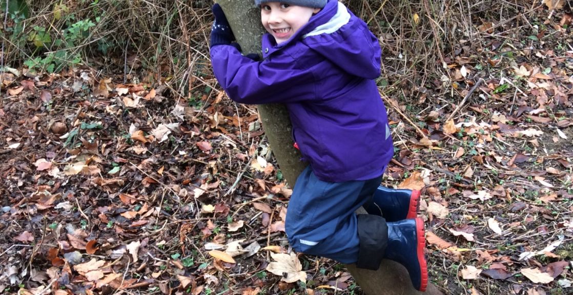 wycliffe boy hugging a tree