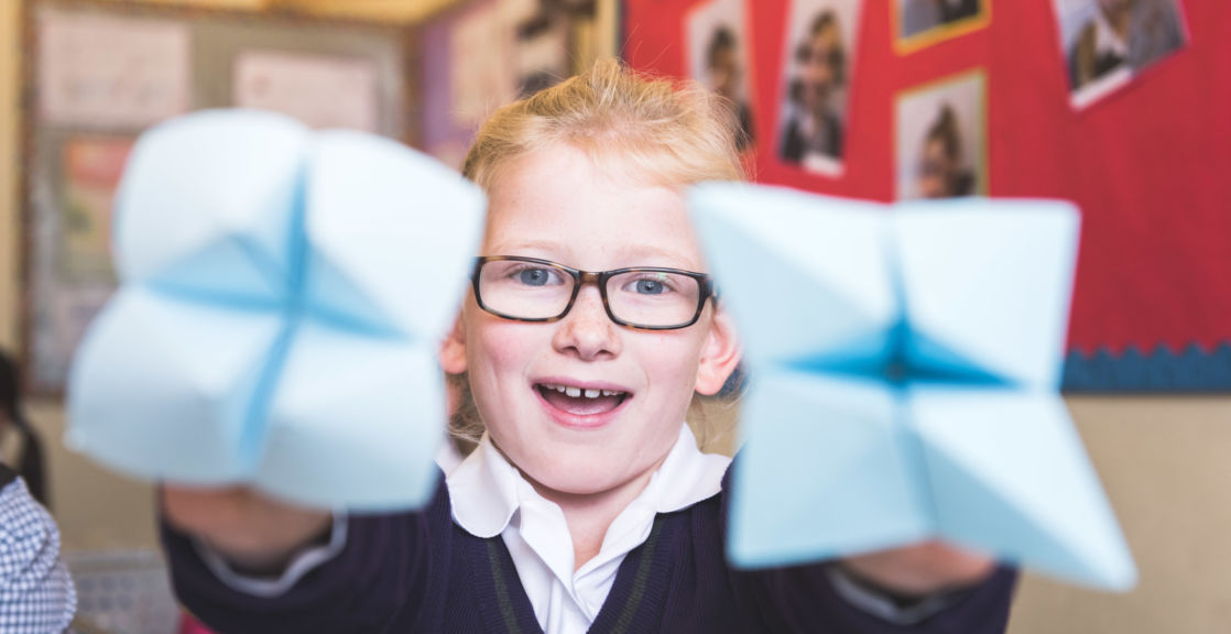 wycliffe pupil holding origami pieces