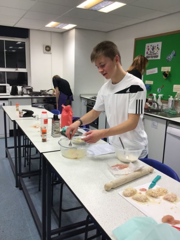 pupil cooking at cooking club at wycliffe independent school