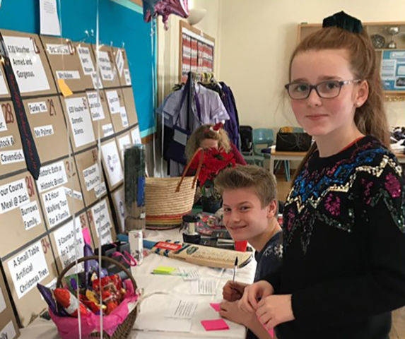 Toby and Alice organised an auction of promises at the Christmas Fayre