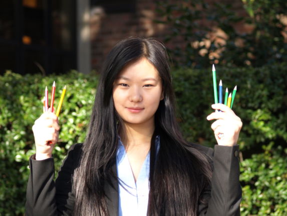 wycliffe pupil sophia holding colored pencils