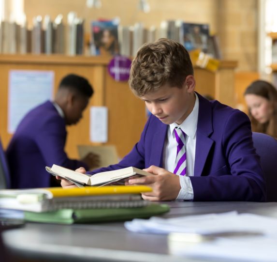 student reading in library