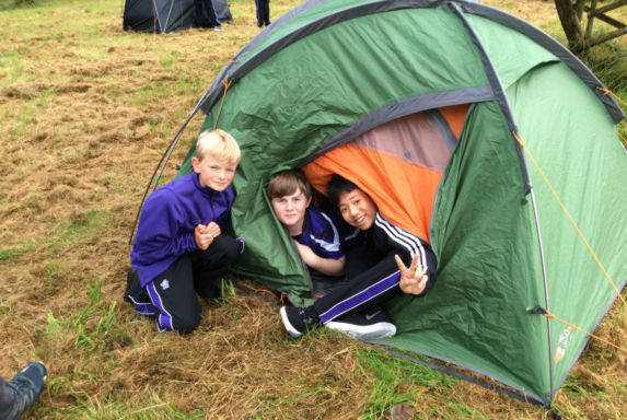 Wycliffe boys camping outdoors