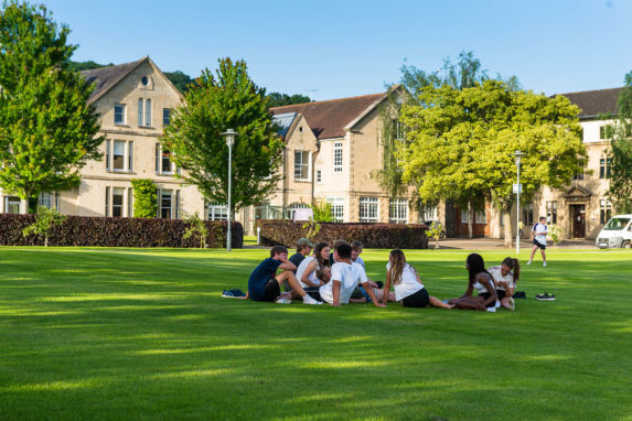 Wycliffe students sitting outdoors