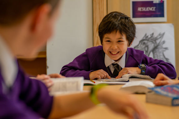 wycliffe boy smiling in class