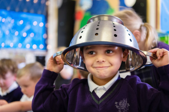 wycliffe nursery pupil wearing a strainer on his head