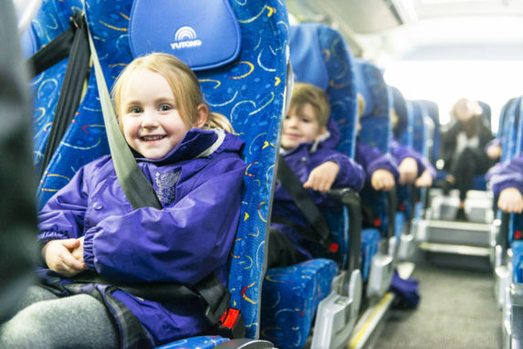 wycliffe nursery kids riding a minibus