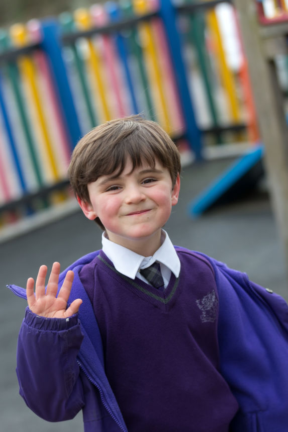 wycliffe boy smiling in the playground